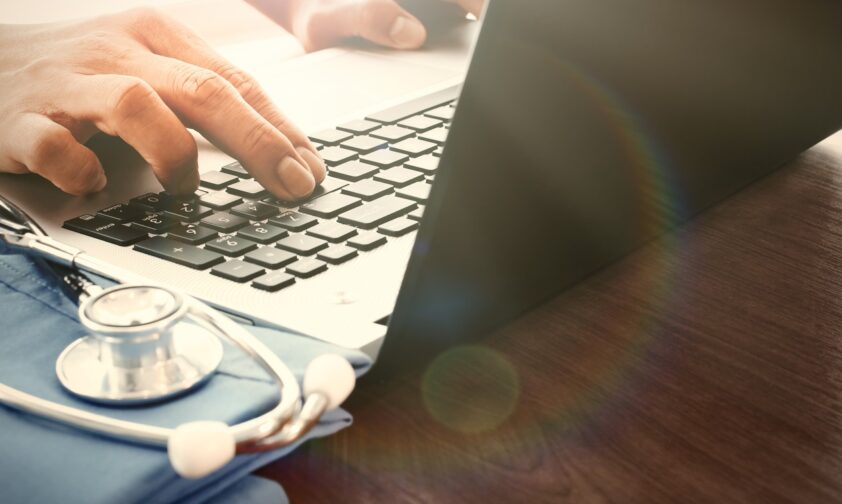 Doctor on Computer with Stethoscope